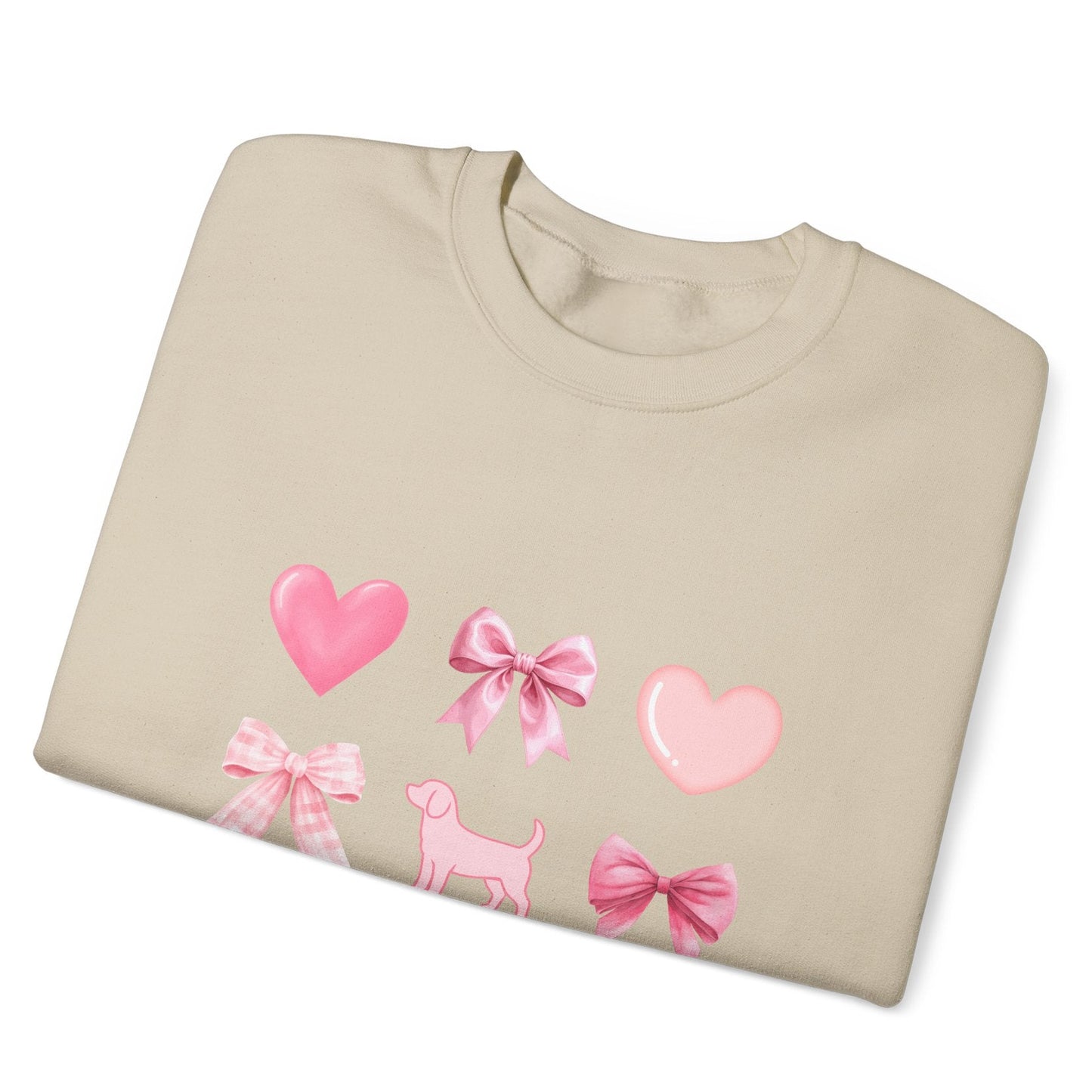 Folded view of sand unisex sweatshirt with heart, bow, beagle design