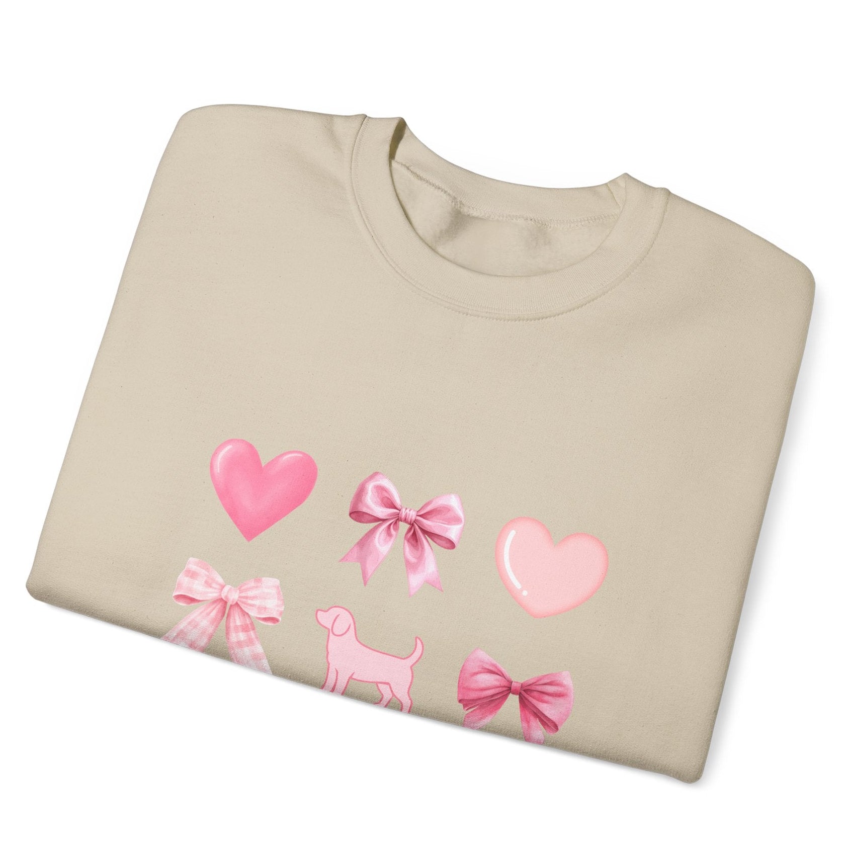 Folded view of sand unisex sweatshirt with heart, bow, beagle design