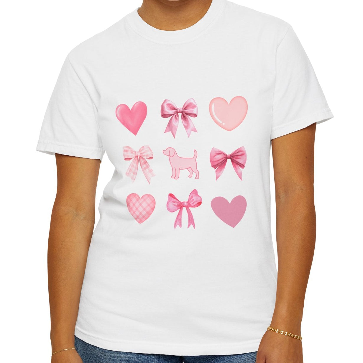 Front of white short sleeve shirt with pink hearts, bows, and a beagle graphic female model