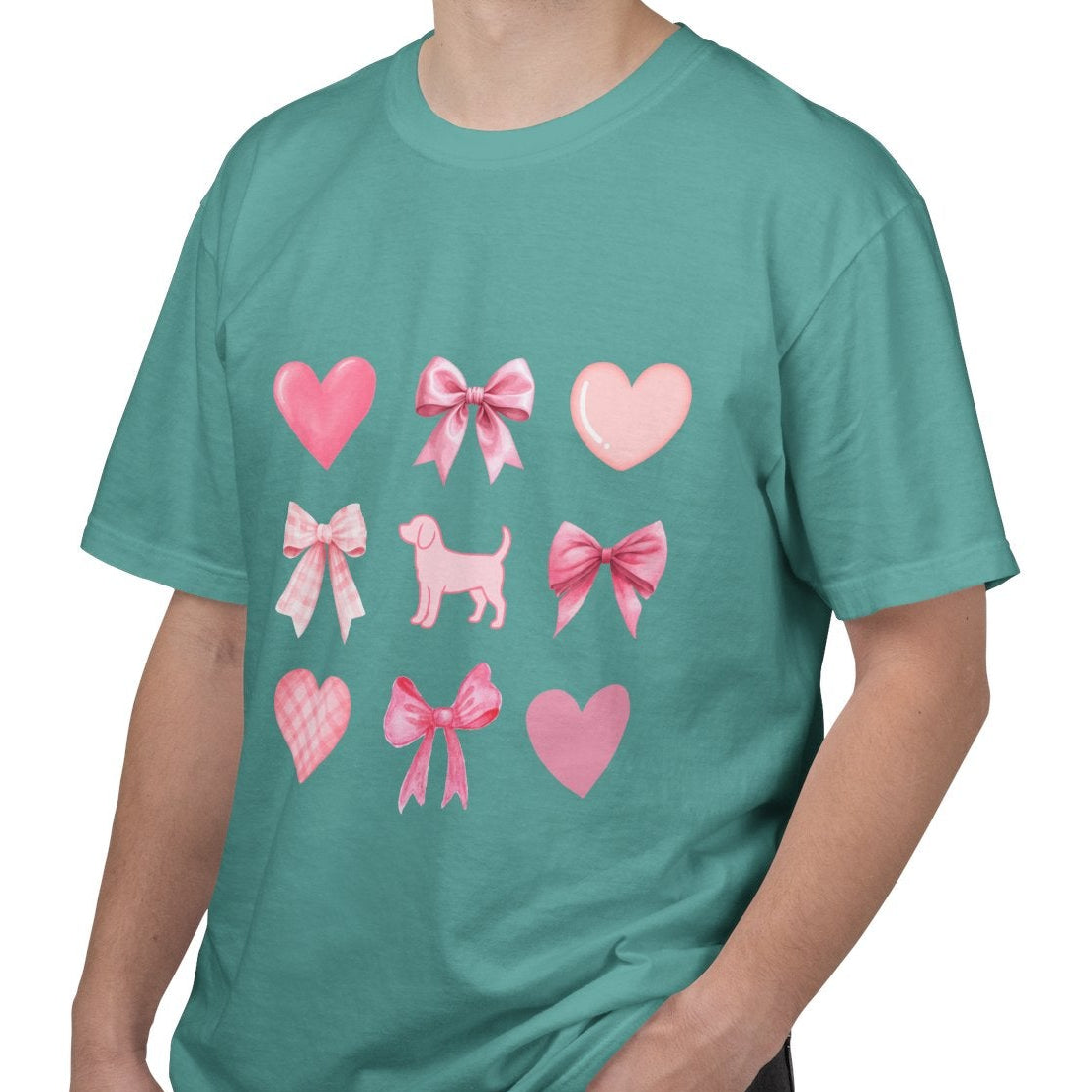Front of seafoam short sleeve shirt with pink hearts, bows, and a beagle graphic male model